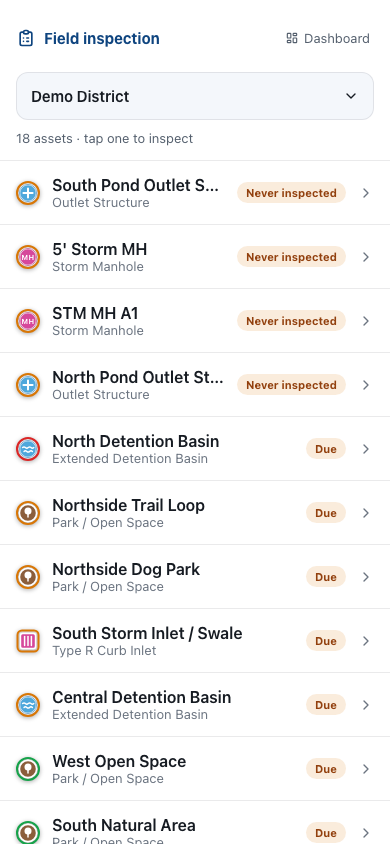 DistrictWorks field inspection mode on a phone showing condition rating buttons and photo capture